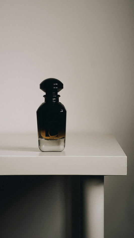 a bottle sitting on top of a white table